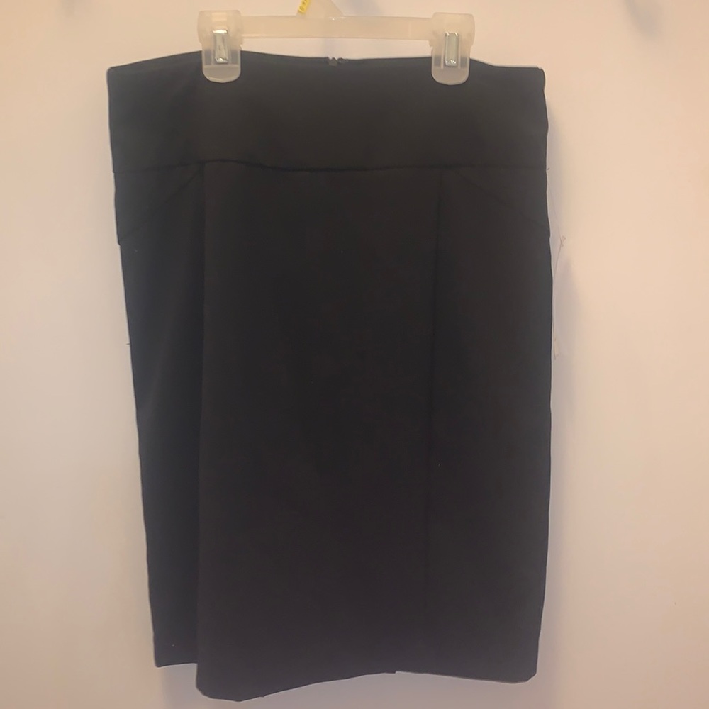 NY Collection: Elegant and classic straight black skirt with kick pleat.